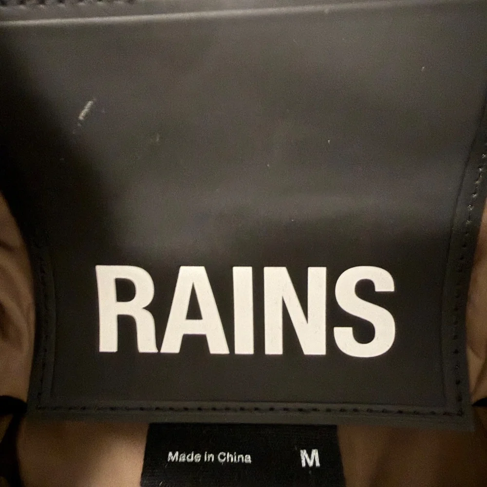 Rains Long Puffer Coat in Brown - Picture 14 of 16